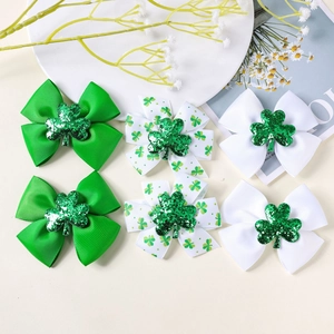 Detail view of 6-piece St. Patrick's Day shamrock bow clips with glitter center
