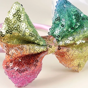 Cerchietto colorato con fiocco di paillettes arcobaleno per bambine e feste speciali