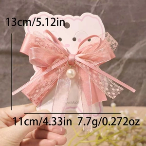 Detailed view of pink lace bow hair clip with pearl pendant and size measurements