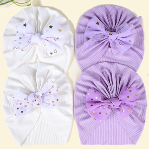 Detailsicht von 4 Baby-Turbanen mit Netzschleifen und goldenen Stern-Pailletten