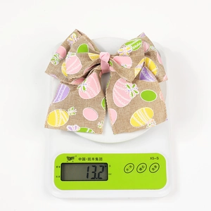 Detailed view of large burlap Easter bow on scale showing lightweight 13.2g weight