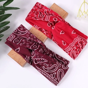 Bandeaux torsadés à motif paisley rouge et bordeaux sur blocs de bois pour femme