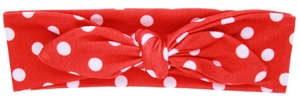 Detail view of the red cotton baby headband with white polka dots and cute bunny ears