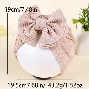 Newborn baby soft turban hat with large bow detail in pink jacquard knit fabric