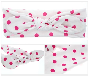 Détails du bandeau en tissu blanc à pois rose fuchsia avec nœud en forme d'oreilles de lapin