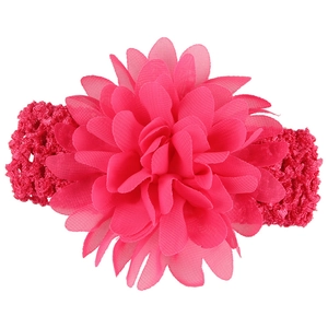 Close-up of rose red chiffon flower detail and elastic crochet texture on baby headband