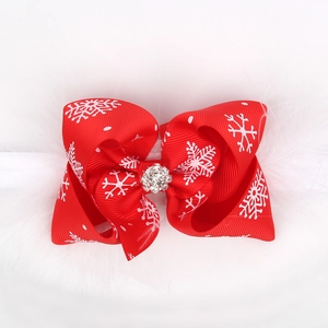 Christmas baby headband with red snowflake bow and white feathers on a white background