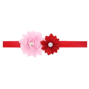 Elastic baby headband with red floral design, pink fabric rose and rhinestone detail