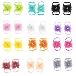 Detail view of baby barefoot sandals in 12 colors with chiffon flowers and pearls