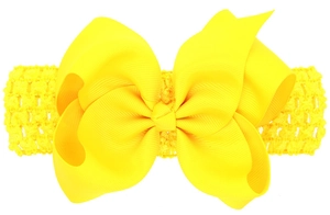 Vista dettagliata del fiocco giallo brillante in grosgrain su fascia elastica all'uncinetto