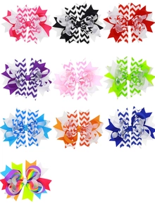 Close-up of colorful chevron patterned grosgrain ribbon hair bows for young girls