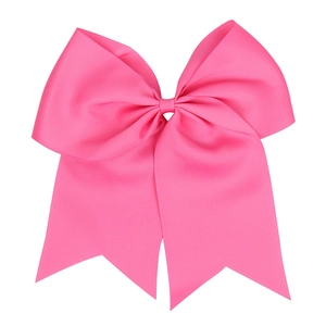 Detailed texture of pink grosgrain ribbon on a large swallowtail bow hair accessory