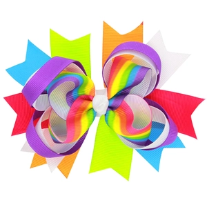 Handmade rainbow layered bow hair clip for girls with colorful grosgrain ribbon on white background
