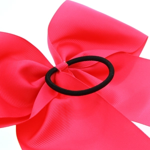 Hot pink grosgrain ribbon hair bow with durable black elastic band for girls