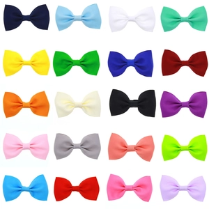 Set of 20 colorful grosgrain ribbon bow hair clips for girls in a neat grid display