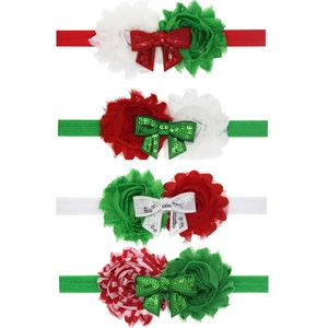 Detail of baby Christmas headbands with fabric flowers and glitter sequin bows set of four