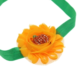 Kids Halloween headband set featuring green elastic band and yellow flower with pumpkin pendant