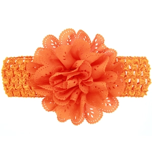 Detail of orange hollow lace flower and wide crochet elastic headband for babies