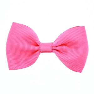 Hot pink grosgrain ribbon bow hair clip for girls with ribbed texture and durable grip