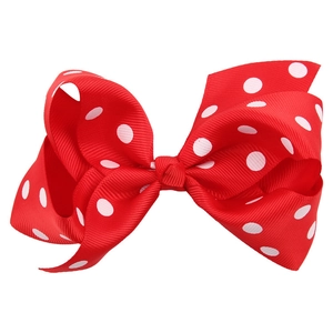 Vue détaillée du nœud en ruban gros-grain rouge à pois blancs de 11cm pour enfants
