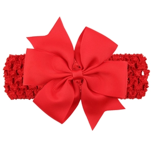 Detail of red grosgrain bow and wide elastic crochet headband for baby girls