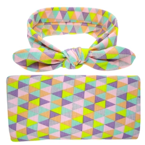 Detail of baby swaddle and bunny ear headband set with colorful geometric triangle pattern