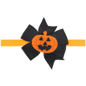 Bandeau bébé Halloween avec nœud en ruban noir et breloque citrouille étincelante