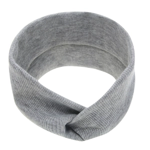 Detail of grey knitted baby headband with elastic ribbed texture and a twisted knot design
