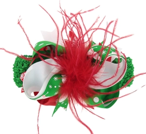 Detail of Christmas bow headband with green crochet elastic band and red feather accent