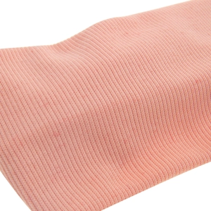 Pink rib-knit elastic baby headband with soft texture and cross knot design details