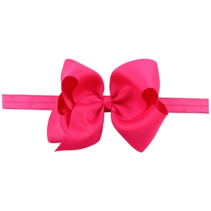 Detail of rose red bow headband showing high-quality ribbed texture and elastic band