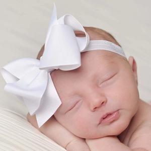 Newborn baby headband with 12cm white grosgrain ribbon bow on soft elastic band
