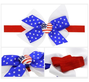 Detail of USA flag themed bow headband with heart resin center and red elastic band