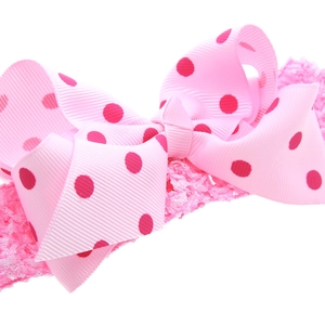 Bandeau rose à pois pour enfants avec nœud en gros-grain et texture crochet extensible
