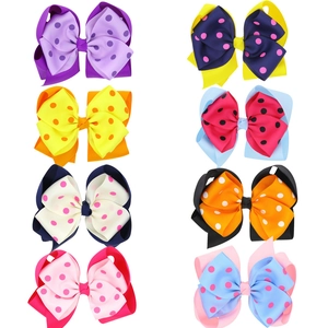 Set of 8 colorful polka dot double layer bow hair clips for girls on white background