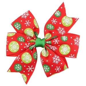 Christmas bow hair clip with red and green grosgrain ribbon and white snowflake patterns