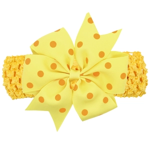 Bandeau jaune pour bébé avec grand nœud à pois fabriqué en tissu crochet élastique