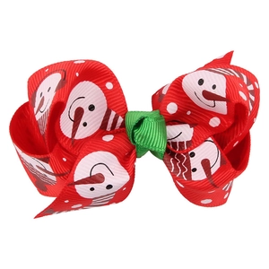 Close-up of Christmas snowman print on red grosgrain ribbon hair bow for kids