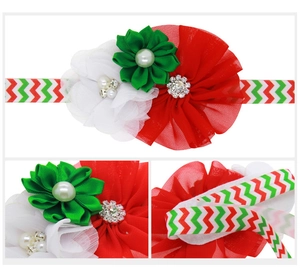 Close-up of Christmas chiffon flowers with pearls and rhinestones on wave elastic band