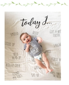 Close-up of a soft muslin baby milestone blanket for photography showing growth milestones