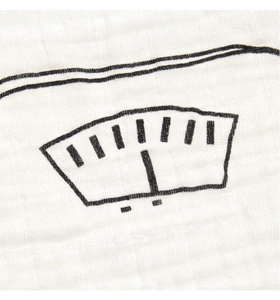 Detailed close-up of white multi-layer cotton muslin fabric with soft wrinkled texture