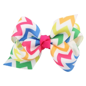 Detail of the high-quality grosgrain ribbon bow with colorful wave patterns and pink knot