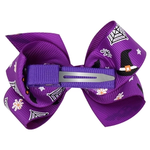 Detail of the purple ribbon wrapped metal alligator clip on the Halloween hair bow
