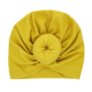 Bright yellow infant turban hat with a 3D donut knot design in soft knit cotton fabric