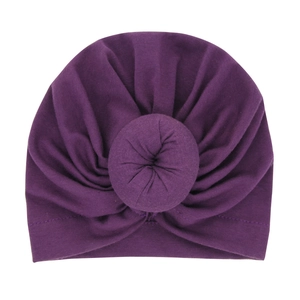 Dark purple newborn donut turban hat in elastic ribbed knit cotton for baby girls