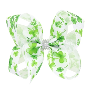 Nœud à cheveux blanc avec motifs trèfles verts et centre en strass brillants