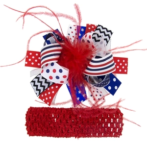 Detail of child hair accessories set with patriotic ribbon bow and feather accent
