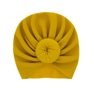 Mustard yellow waffle knit baby turban hat with a cute donut knot for infants