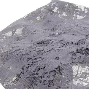 Pale purple lace baby beanie with intricate floral pattern and mesh texture