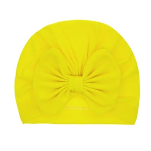 Bright yellow newborn baby beanie featuring a large decorative bow made of soft cotton fabric